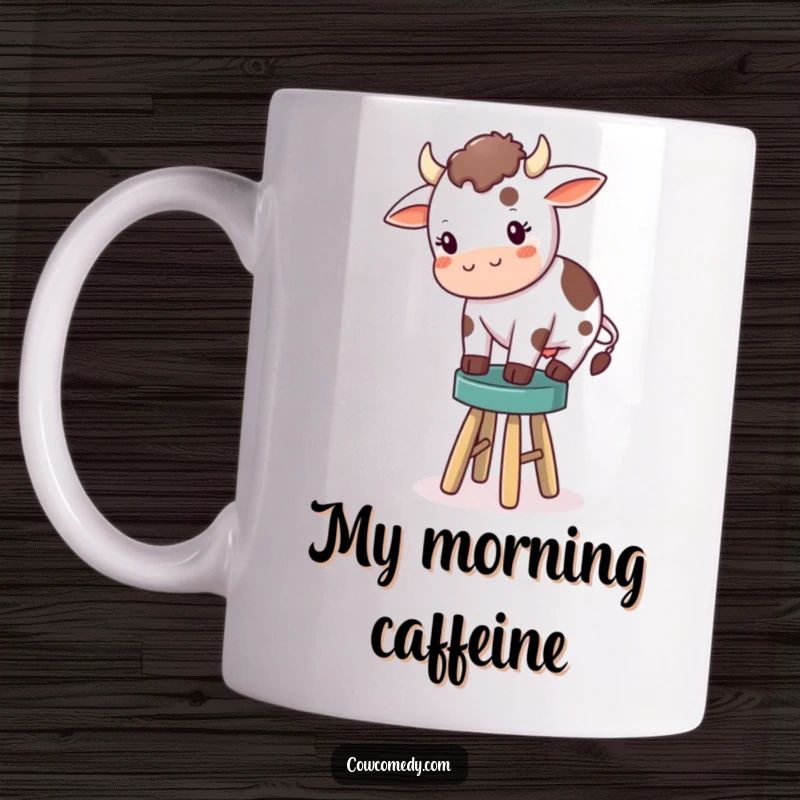 Funny mug featuring a cute little cow with a determined expression, struggling to balance on a comically tiny wooden stool in a farm setting.