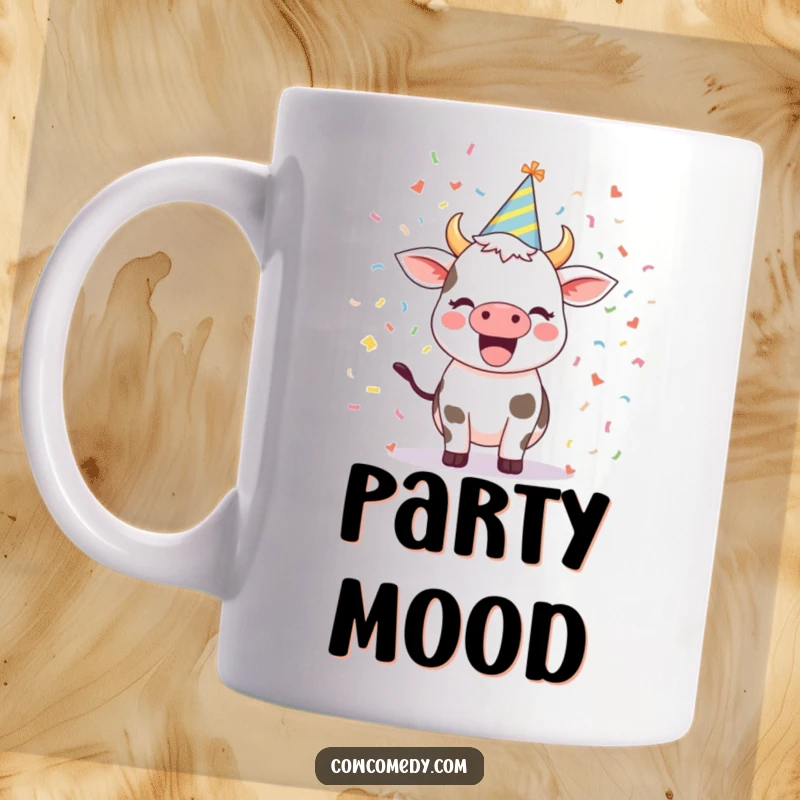 Funny mug featuring an excited cow wearing a colorful party hat amidst a shower of festive confetti, a joyful celebration design.