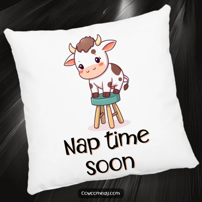 Funny pillow print of a small cow precariously trying to balance its body on a tiny, inadequate stool, adding humor to any seating area.
