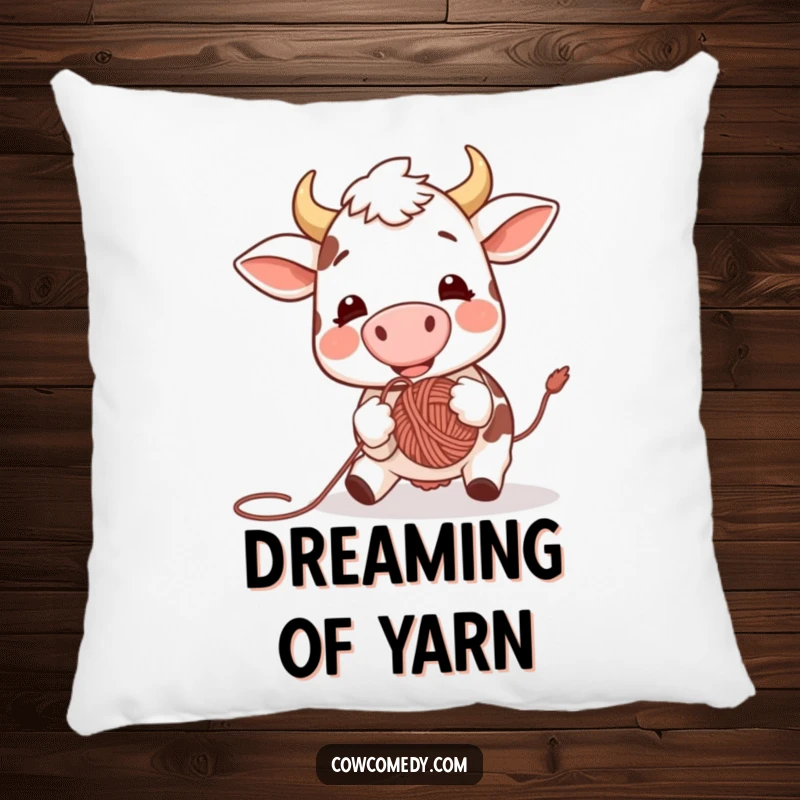 Funny pillow design of a cheerful cow using its nose to bounce a ball of yarn, adding a playful and humorous touch to any room.