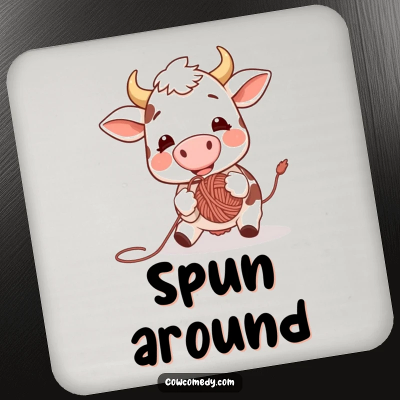 Funny coaster print of an excited cow joyfully bouncing a ball of yarn with its nose, providing surface protection with a smile.