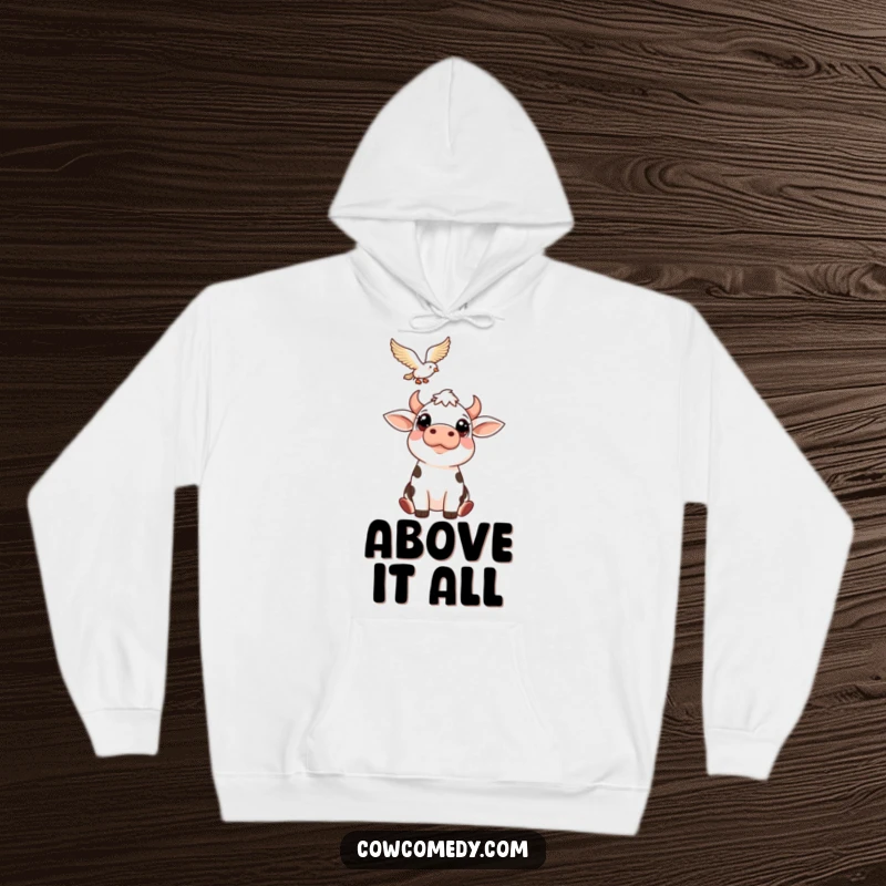 Funny hoodie illustration of a curious cow with wide eyes looking up at a soaring bird. Comfortable and humorous outerwear.