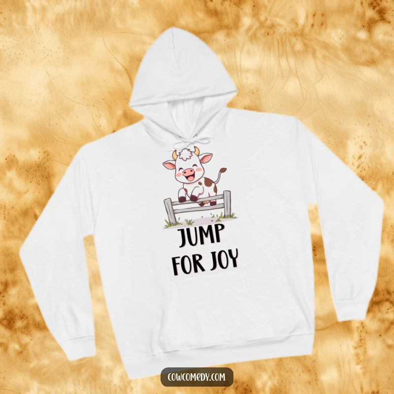 Funny hoodie with a joyful cow leaping over fence, mid-moo, offering warmth and playful energy, a thoughtful gift.