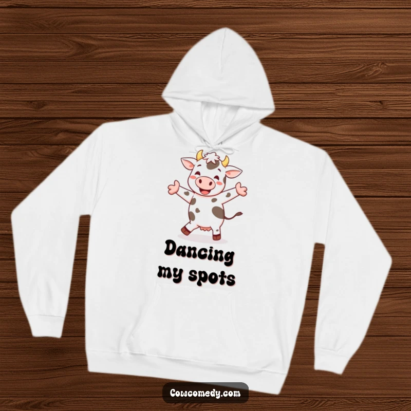 Funny cheerful cow jig hoodie featuring a spotted cow happily dancing, offering cozy warmth and infectious fun.