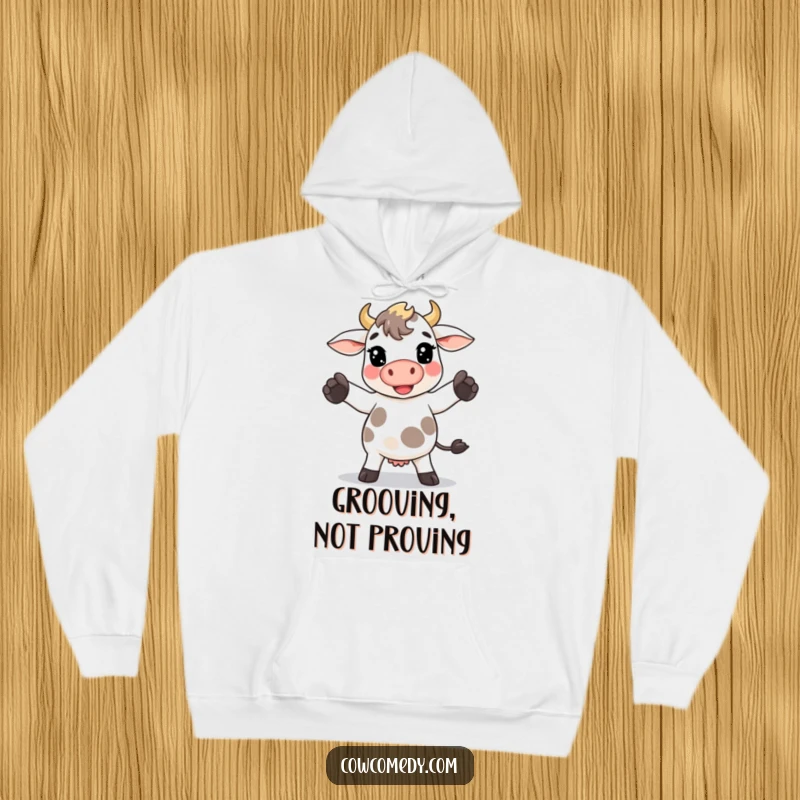 Funny Kawaii cow hoodie depicting a cow doing a goofy dance with its hooves, perfect for cozy fun.