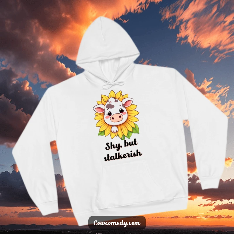 Funny Kawaii cow hoodie with a shy cow peeking from behind a big sunflower, offering warmth and humor.
