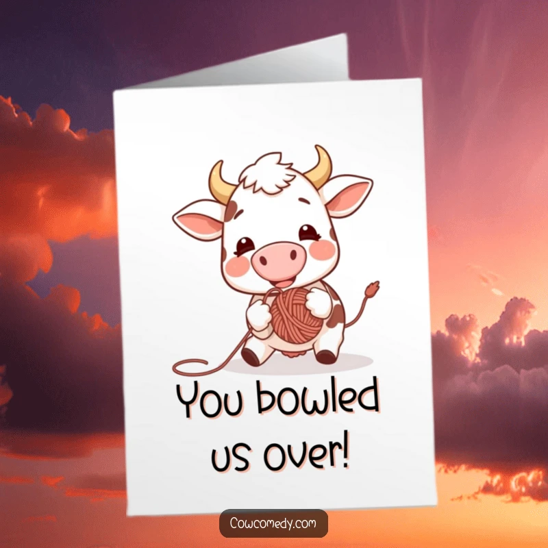 Funny Free Printable Congratulations Card: An excited cow gleefully bouncing a yarn ball with its nose, celebrating your achievement with pure joy.