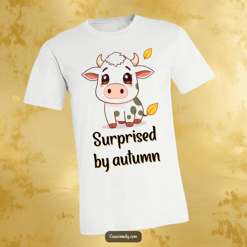 Funny t-shirt with a cow showing surprise as a leaf falls gently from above. A whimsical and charming graphic tee.