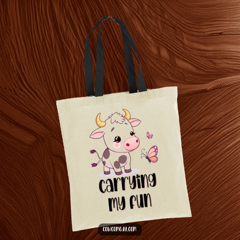 Funny Tote Bag with a cow wiggling its tail in amusement next to a cartoon butterfly, perfect for carrying goods with style.