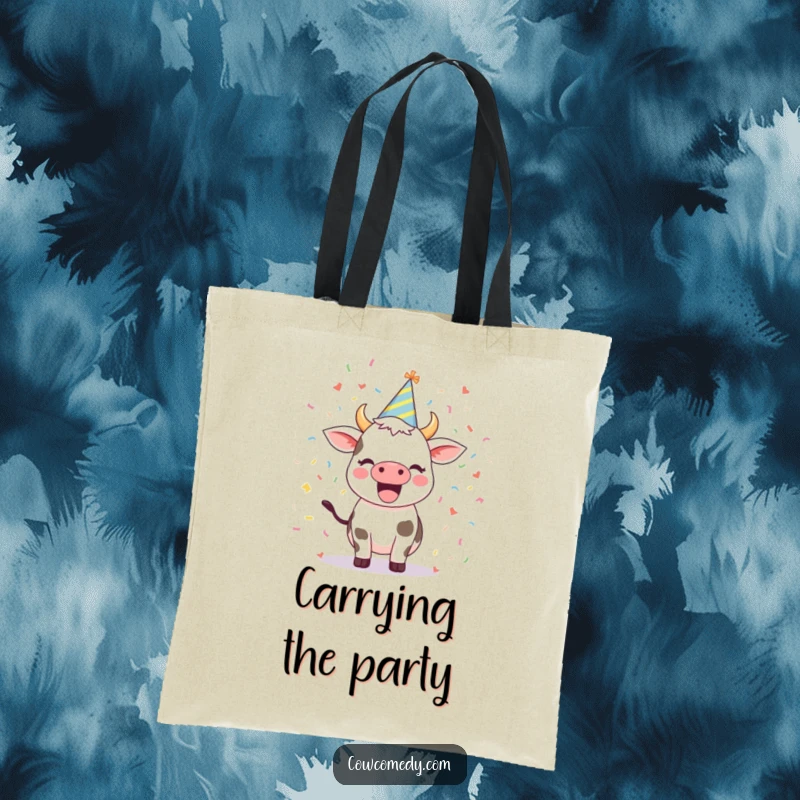 Funny tote bag depicting an excited cow wearing a party hat amidst a scattering of confetti, a stylish and festive accessory.