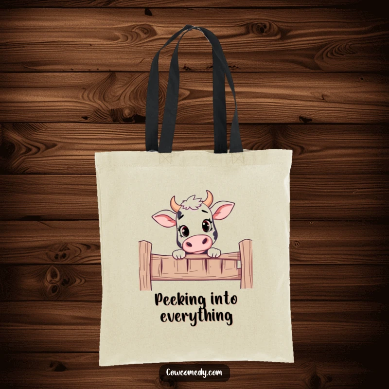 Funny tote bag showing a curious cow peeking over a fence with an inquisitive and friendly expression.